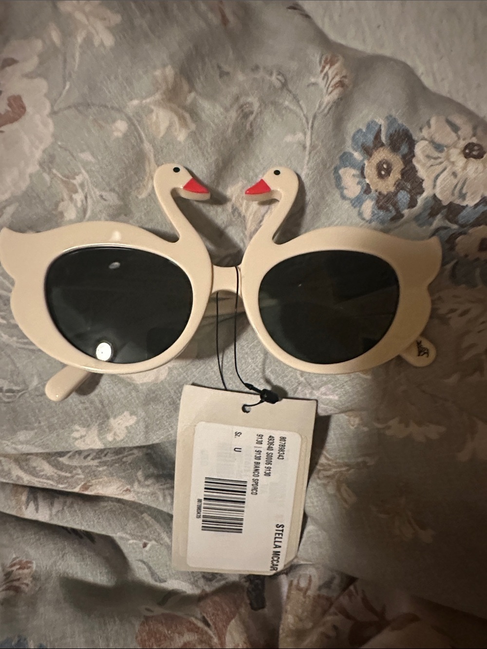 Stella McCartney Cream Swan Sunglasses with Black Lenses and Red Beak Accents